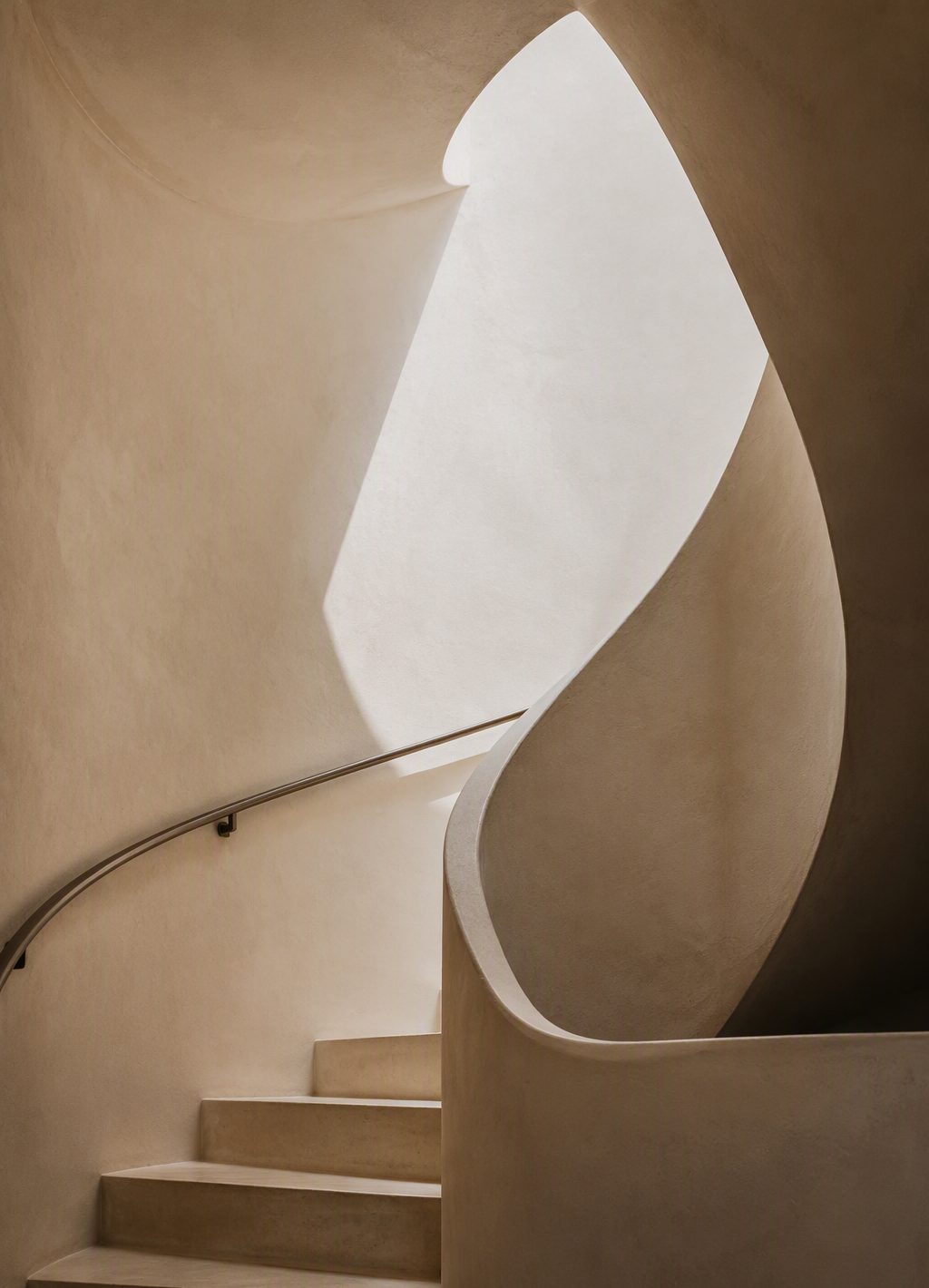 Concept showcase — sculptural plaster staircase with soft skylight